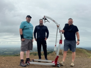 24 NRG Groups management team, pictured on top of the malvern hills during a charity event.